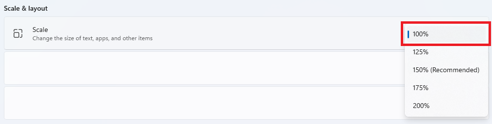 Windows Display Settings showing the Scale setting set to 100%